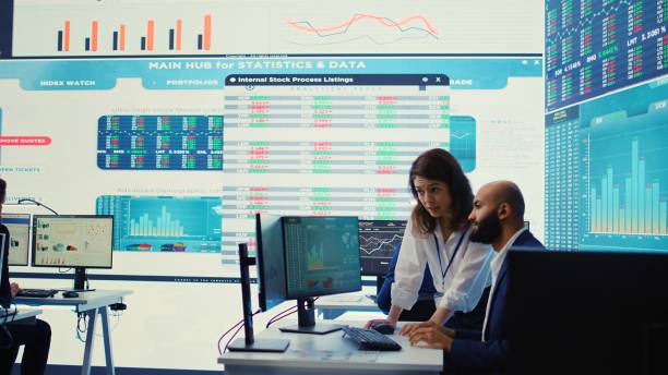 istock Teammates examining statistics and infographics on computer in control room 2156570967