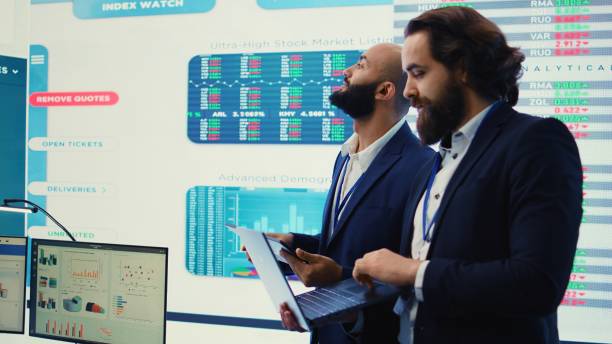 istock Team of investors analyzing profit amount and making decisions 2156571094