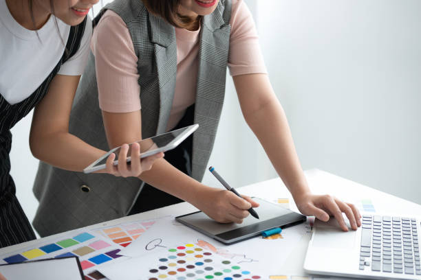 istock Team Designer using laptop to design fashion clothes. 2156572019