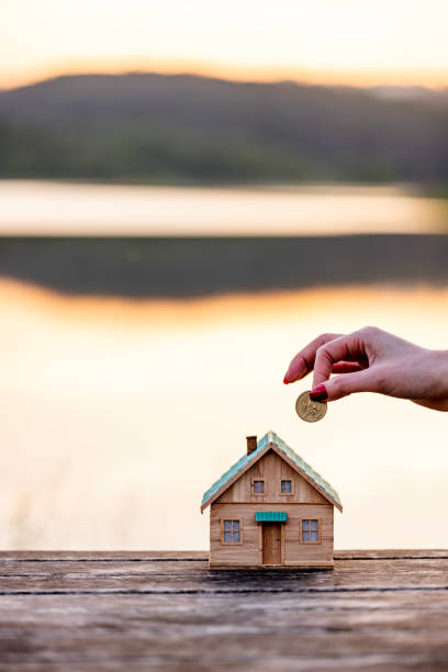 istock Real Estate Agent with house model and saving concepts 2156572711