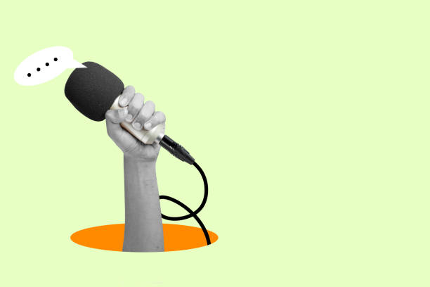 A human hand holding the microphone with a speech bubble