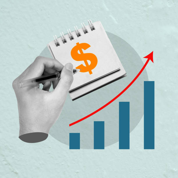 istock A human hand draws a dollar sign with an increased graph arrow 2156581300