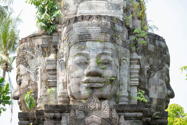 Candi Mendut, Magelang, Indonesia - May, 22th 2024. Ancient Buddha face statue on the stone building with blue sky background