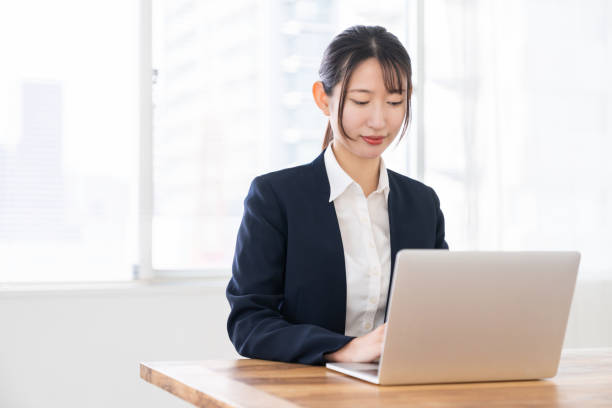 istock young asian businesswoman using laptop 2156582881
