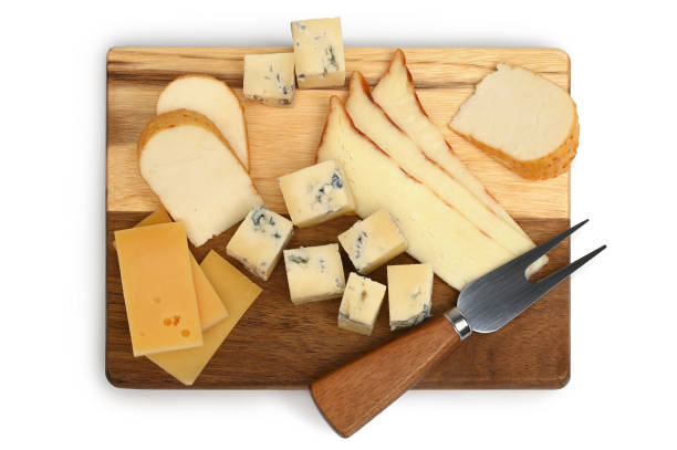istock Variety of cheeses with cheese forkon on a wooden board 2156589778