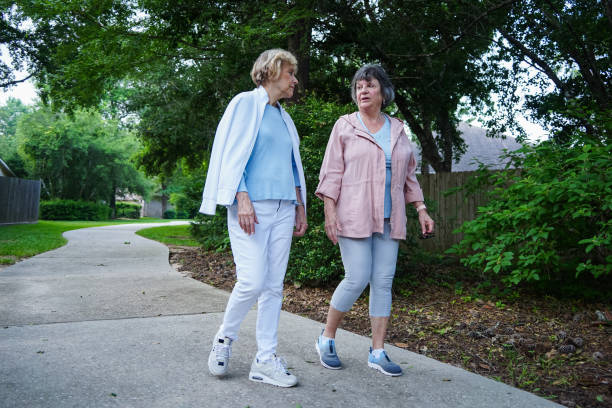 istock Two senior women taking a stroll outdoors 2156593112