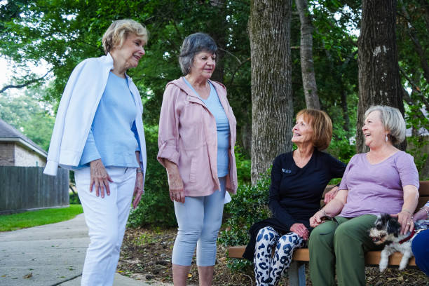 istock Group of senior women talking mid-exercise at a park bench 2156593117