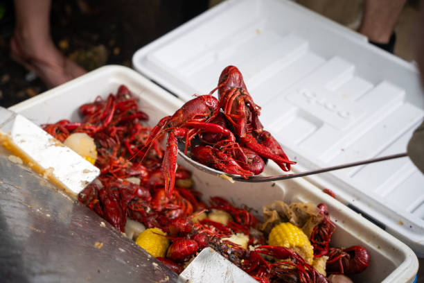 Cooked crawfish being scooped from the bunch