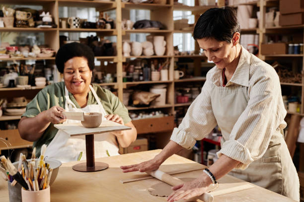 istock Women in Pottery Class Enjoying Retirement 2156595448