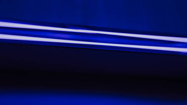 Neon blue and purple lights representing fast moving technology fiber optic high speed data transfer communication AI stock image. Real photograph not created using AI