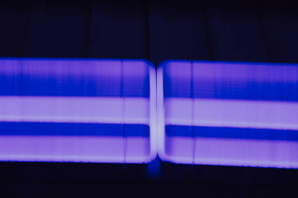 Neon blue and purple lights representing fast moving technology fiber optic high speed data transfer communication AI stock image. Real photograph not created using AI