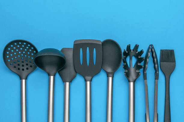 istock Set of Black Kitchen Utensils on Blue Background - Cooking and Baking Tools 2156597673