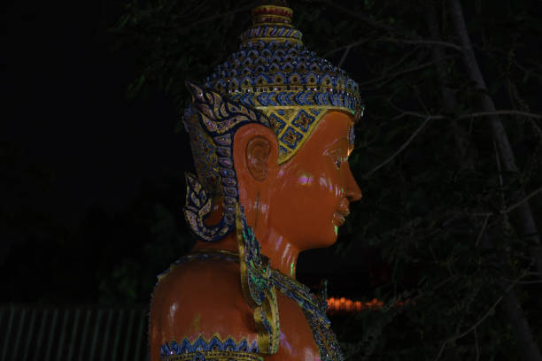 Big Buddha statue outdoors at night.