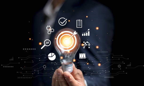 istock businessman holding a light bulb Business planning concepts, high-performance business processes and workflows and problem solving, quality control and long-term business evaluation tracking. 2156604549