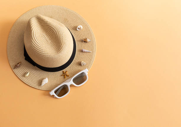 istock flat lay with straw hat, dark glasses and seashells, sea vacation concept 2156606779