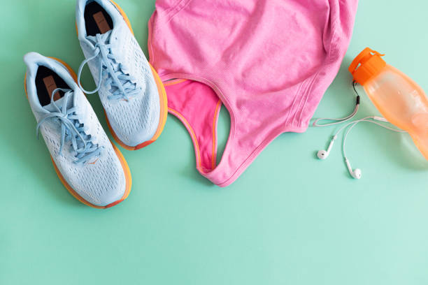 istock Flat lay with colorful sport equipment on light green background 2156607169