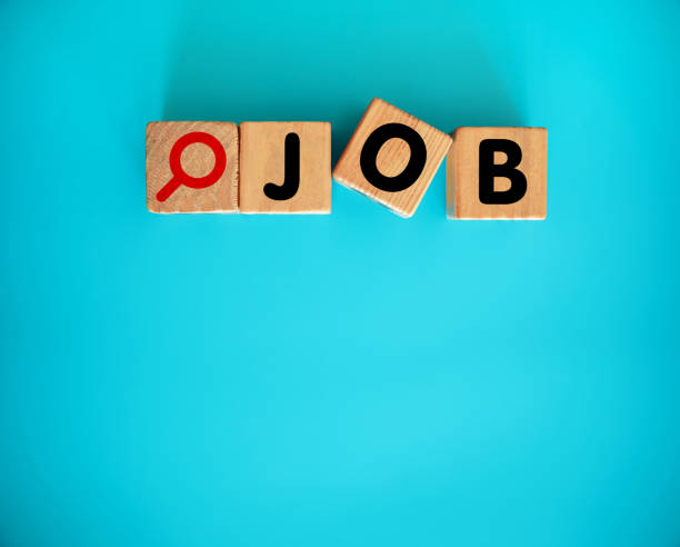 istock JOB word and magnifying Glass Icon on Toy blocks 2156608678