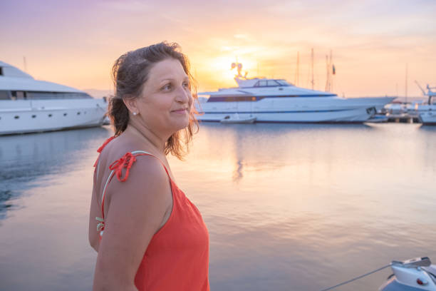 istock Beautiful young woman in a marina. 2156610456