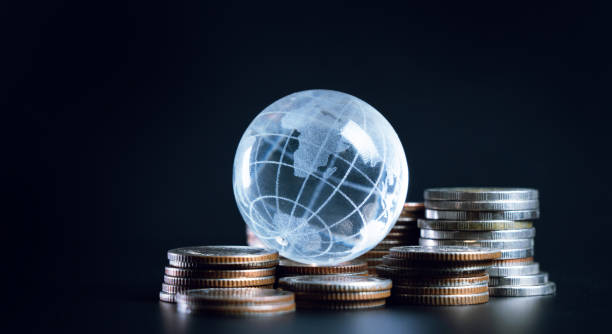 Global Economy Concept with Coins and Globe