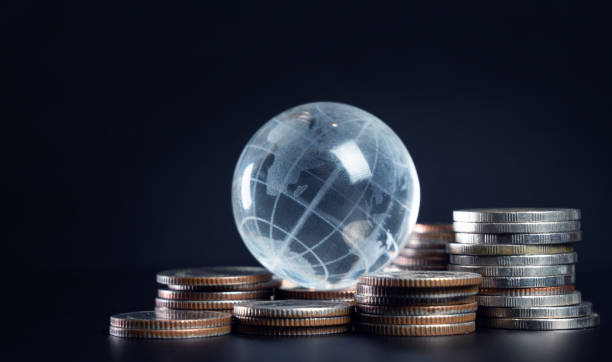 istock Global Economy Concept with Coins and Globe 2156610910