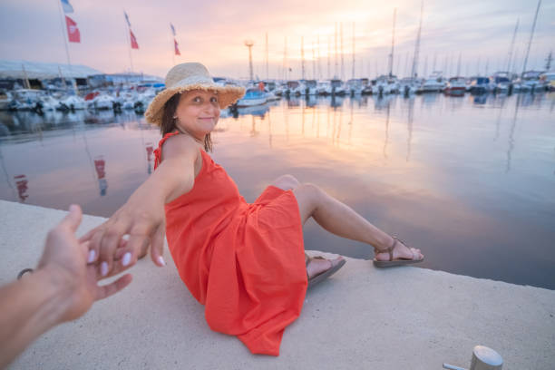 istock Beautiful young woman in a marina. 2156611332