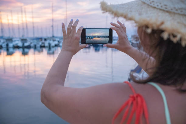 istock Beautiful young woman in a marina. 2156611351