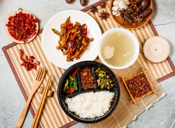 istock Fish flavored shredded pork set with white rice, soup red chilli, chopsticks and fork served in pot isolated on background side view of taiwanese food 2156614385