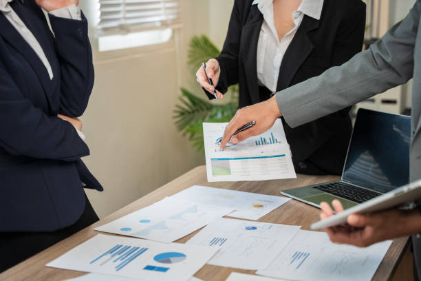 istock Business woman Sitting and working on graph documents 2156615608
