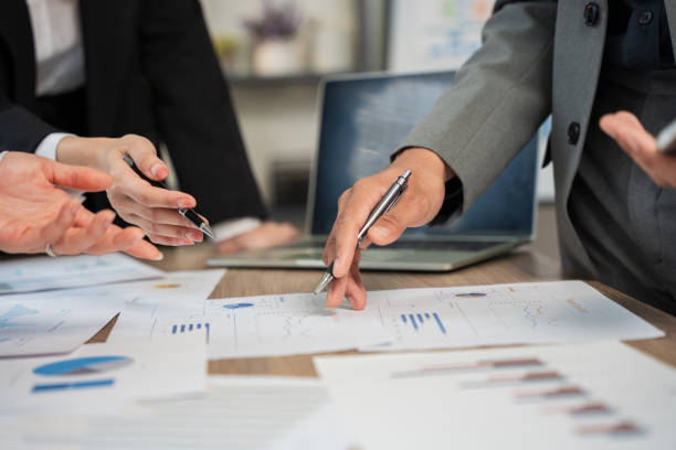 istock Business woman Sitting and working on graph documents 2156615615