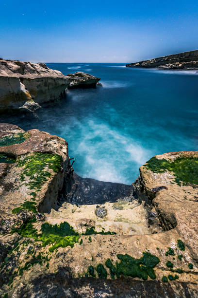 The famous beach of St. Peter's Pool, Marsaxlokk, Malta.