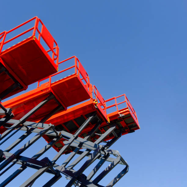 istock Group of red scissor lifts 2156617231