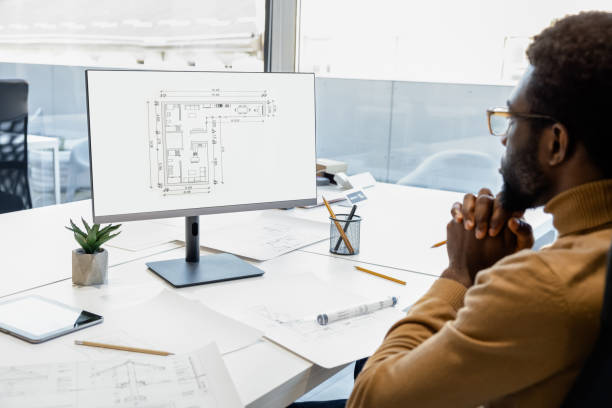 istock Confident man architect incorporating modern technology into construction projects in the office 2156622776