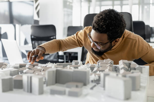 istock Innovative man architect working on construction plans in the office 2156622845