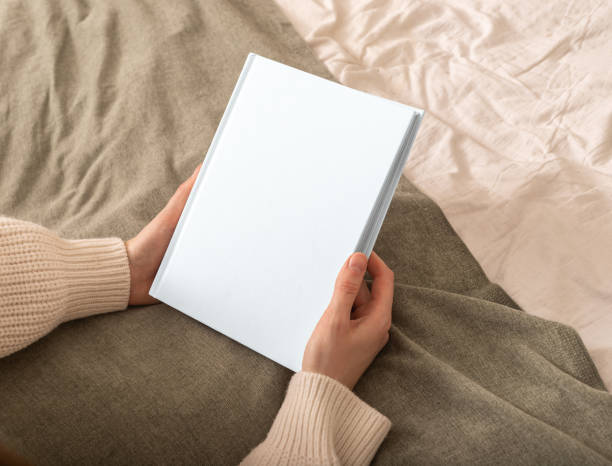 istock Book mockup with cover. Blank magazine template, white handbook. Mock up background design for story 2156624986