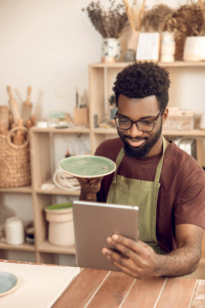 istock Dark-skinned sculptor demonstrating a new product on a webinar 2156628385