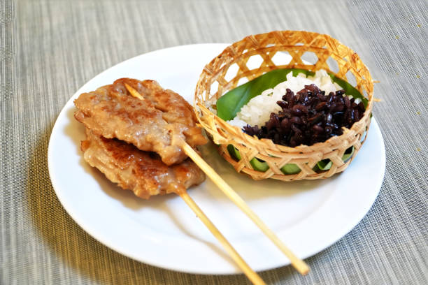 istock Grilled pork sticks and Sticky rice on table. 2156635305