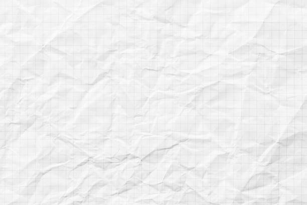 istock crumpled checkered notebook for writing, white paper texture background 2156636375
