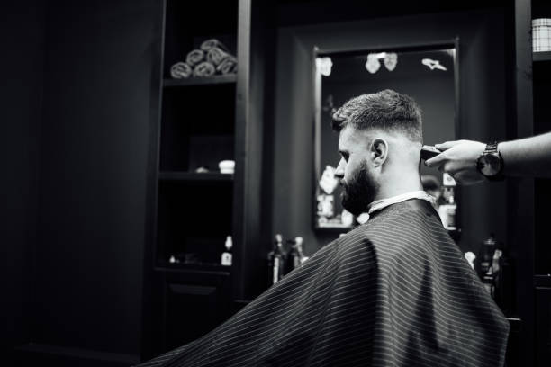 istock A man is getting his hair cut by a barber 2156638347