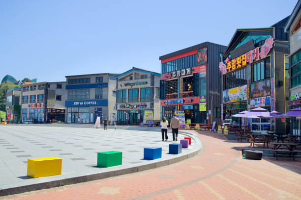 Donghae City, South Korea - May 18th, 2024: A vibrant square near Chuam Beach, featuring colorful seating and a variety of shops and cafes, offering visitors a lively and modern coastal experience.