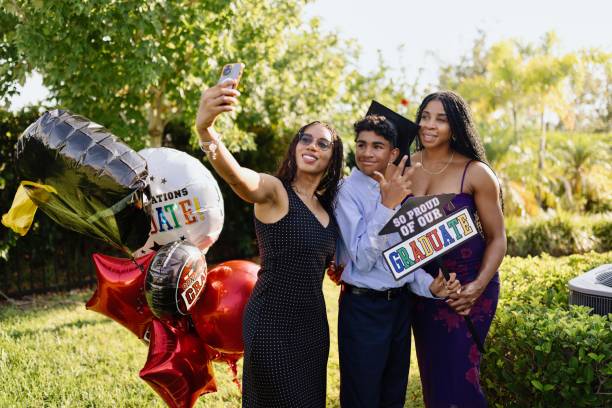 istock Happy family taking selfies during graduation celebration 2156640609