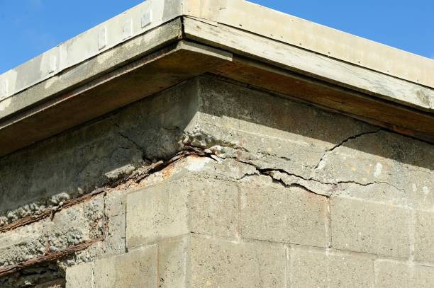 istock Exposed reinforcement bars in a concrete wall 2156644539