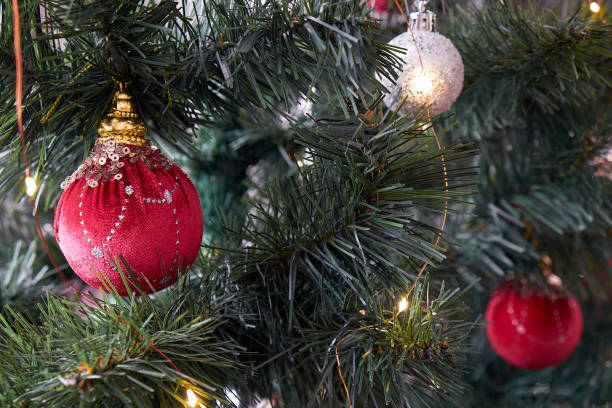 istock Christmas balls are hanging on the tree. 2156652260