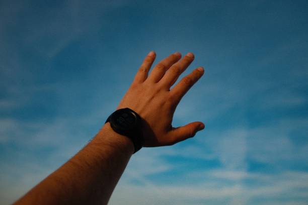 istock Hand Reaching Towards the Sky 2156655234