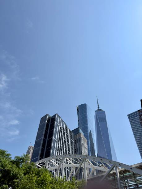 istock Modern skyscrapers downtown New York with bridge and green trees 2156656421