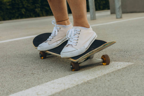 istock close up of skateboarders foot while skating 2156660040
