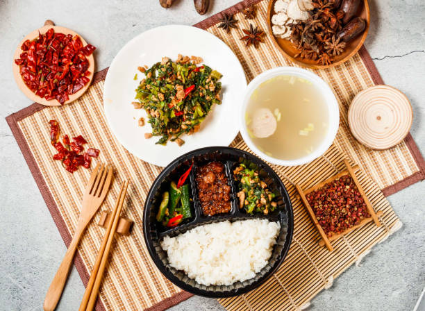istock Snow red minced meat with plain rice, soup, red chilli, chopsticks and fork served in pot isolated on background side view of taiwanese food 2156663131