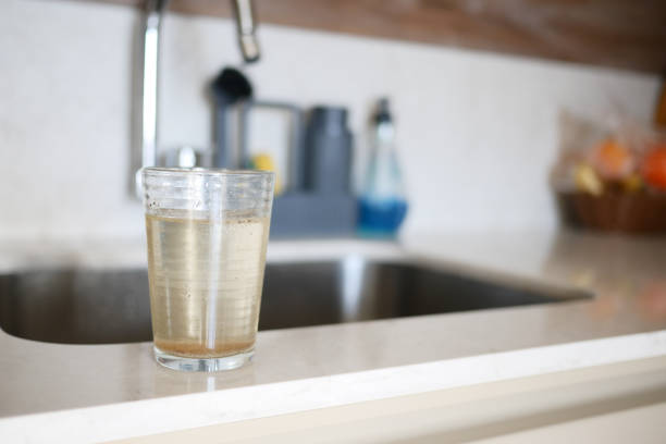 dirty glass of water in a kitchen environment ,