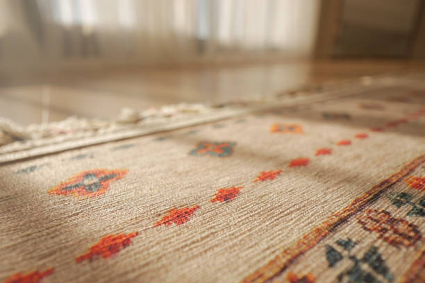istock A patterned rug rests on the flooring beside a mirror 2156666390