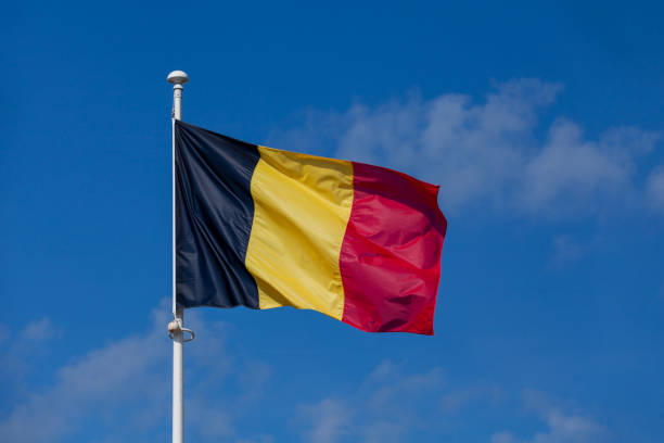 Belgian flag waving atop of its pole