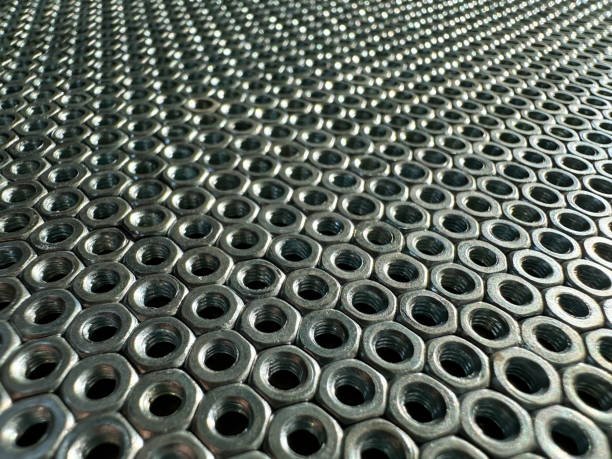 istock Nuts are arranged in a pile on a metallic surface 2156667913
